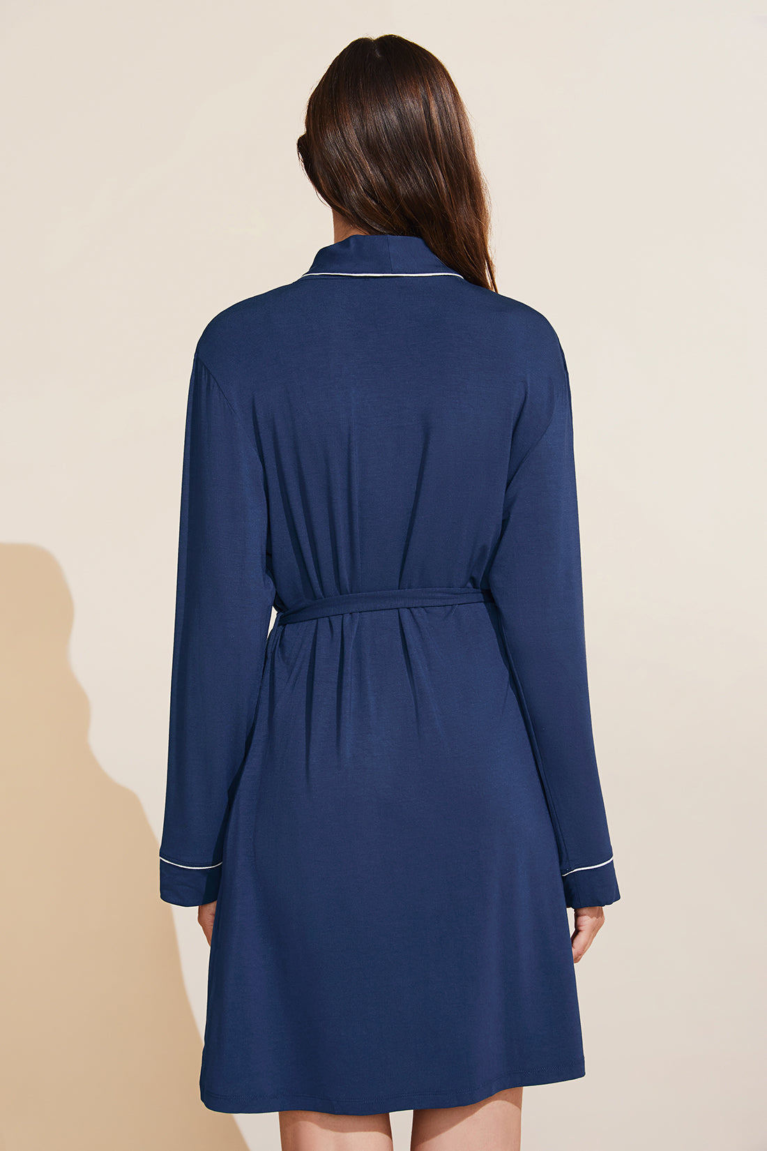 Model is wearing the Gisele TENCEL™ Modal Robe in navy/ivory.