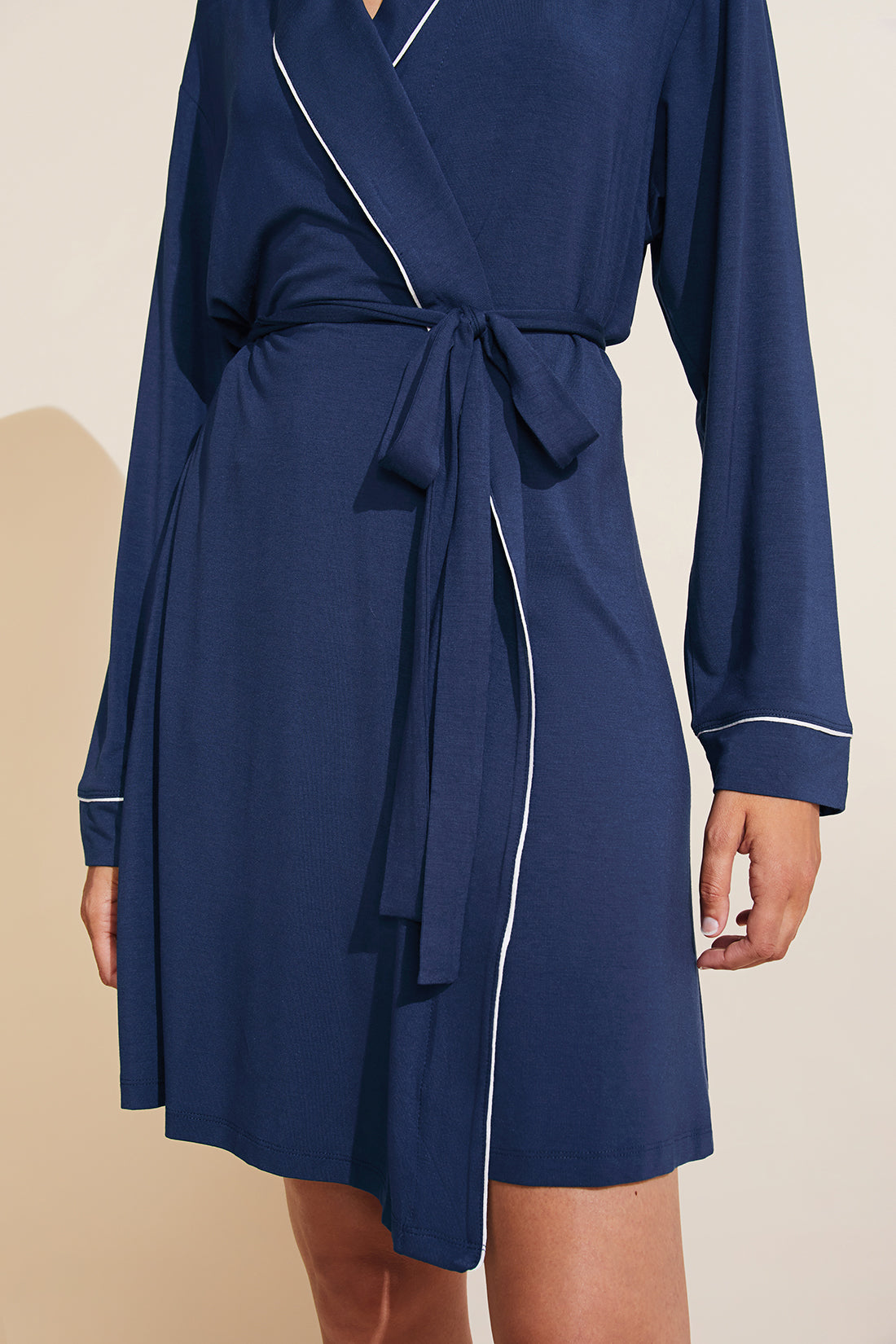 Model is wearing the Gisele TENCEL™ Modal Robe in navy/ivory.