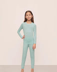 Model is wearing Kids Tencel™ Modal Unisex Long Pj Set in Canal Blue/Ivory