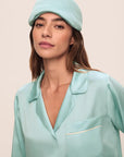 Model is wearing Inez Washable Silk Eye Mask in Canal Blue