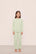 Model is wearing Kid's French Terry Sweatshirt and Jogger Set in  Matcha