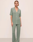 Model is wearing Gisele TENCEL™ Modal Short Sleeve & Pant PJ Set in Eucalyptus/Ivory