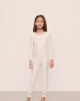 Model is wearing Kids Printed TENCEL™ Modal Unisex Long PJ Set in Heritage Stripe Lt Htr Grey/Pe