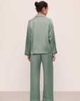 Model is wearing Inez Washable Silk Long PJ Set in Eucalyptus/Ivory