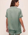 Model is wearing Inez Washable Silk Short PJ Set in Eucalyptus/Ivory