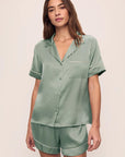 Model is wearing Inez Washable Silk Short PJ Set in Eucalyptus/Ivory
