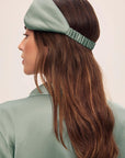 Model is wearing Inez Washable Silk Pillow Eye Mask in Eucalyptus
