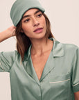 Model is wearing Inez Washable Silk Pillow Eye Mask in Eucalyptus