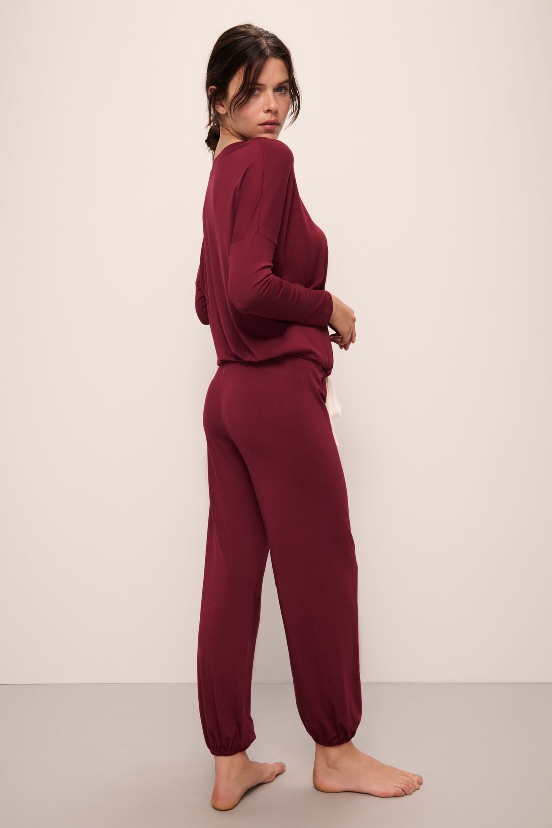 Model wears Gisele TENCEL™ Modal Slouchy PJ Set in Cabernet/Ivory.