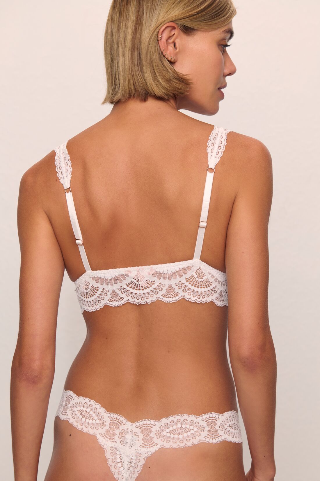 Model is wearing Mariana Thong in White