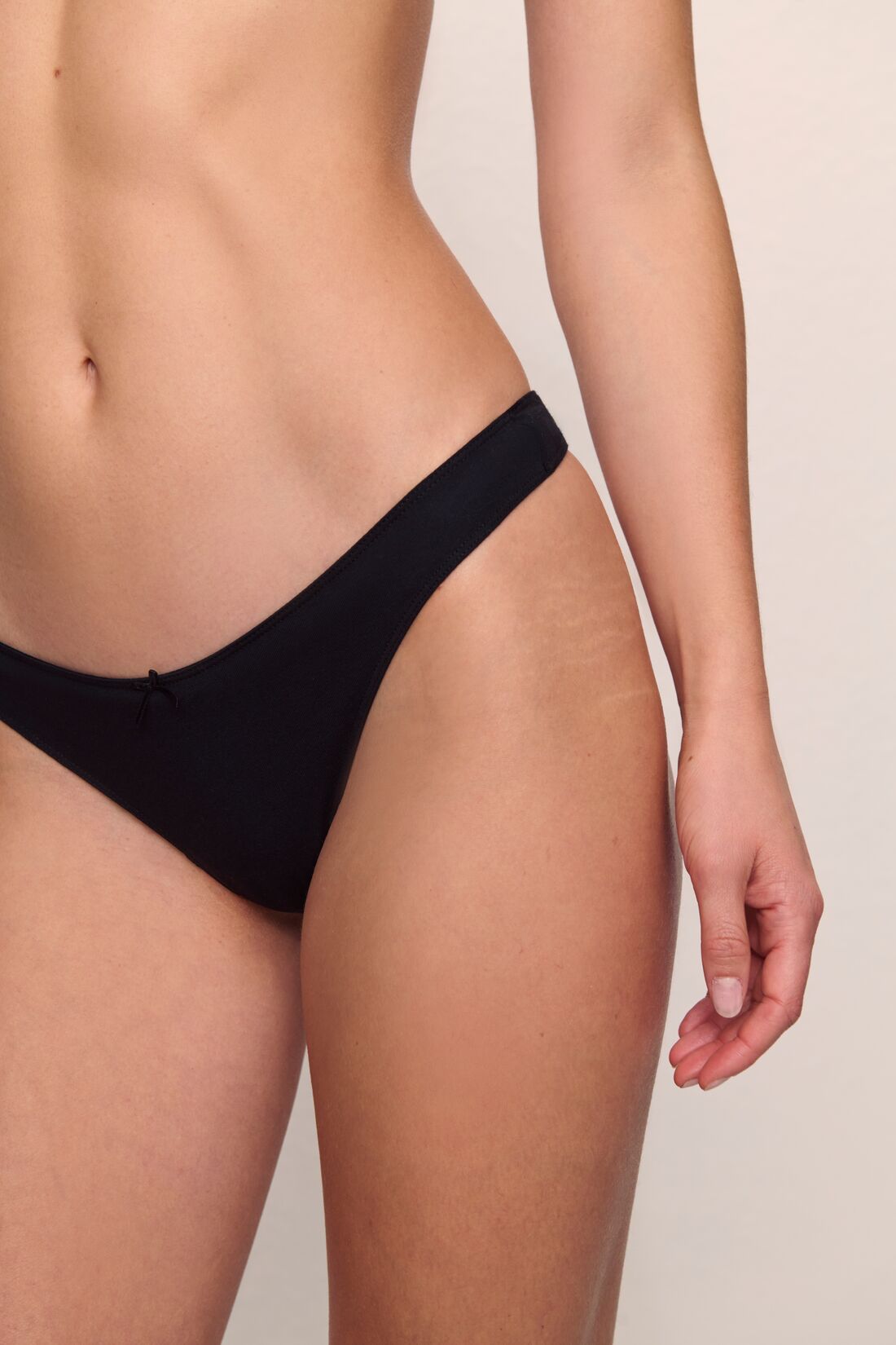 Model is wearing Pima Stretch Cotton Thong in black