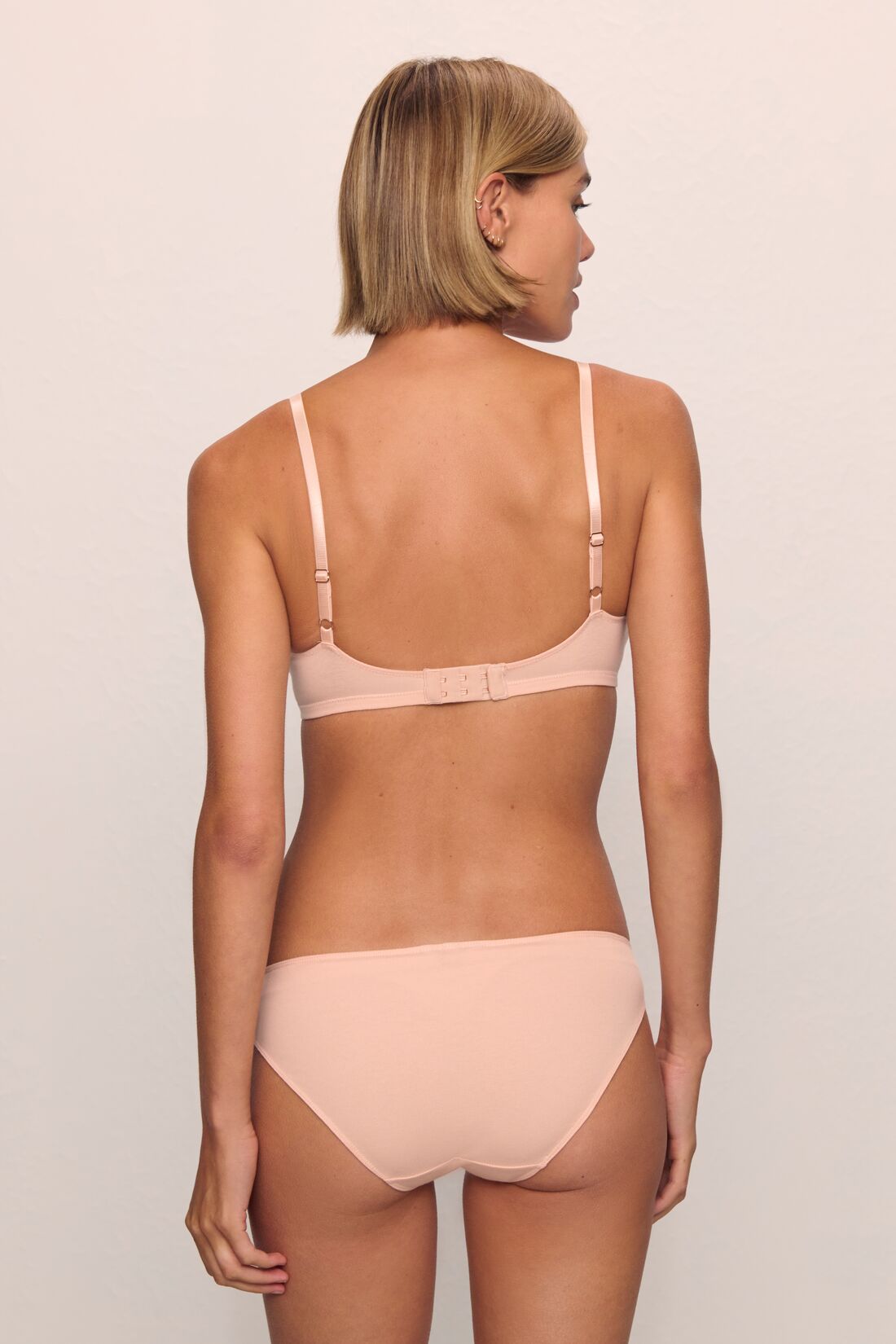 Model is wearing Pima Stretch Cotton Bikini in Buff