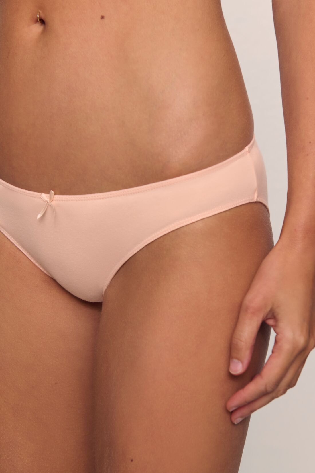 Model is wearing Pima Stretch Cotton Bikini in Buff