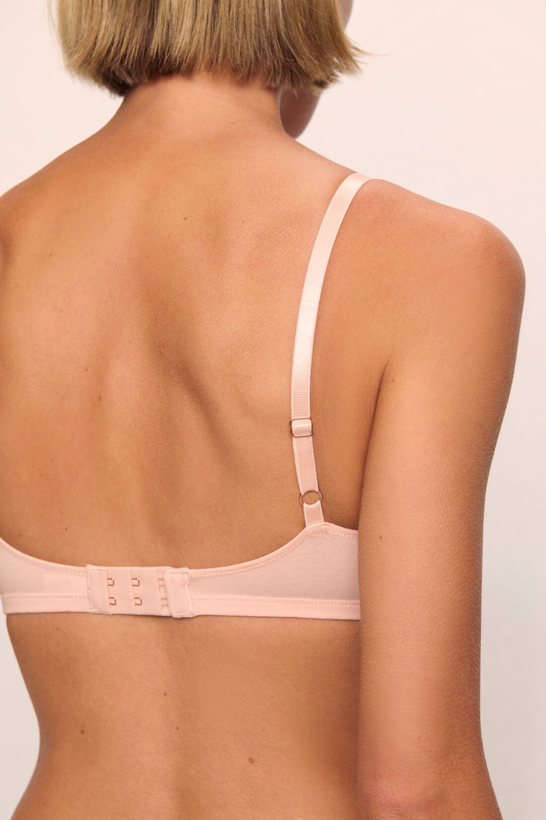 Model is wearing Pima Stretch Cotton Bralette in Buff
