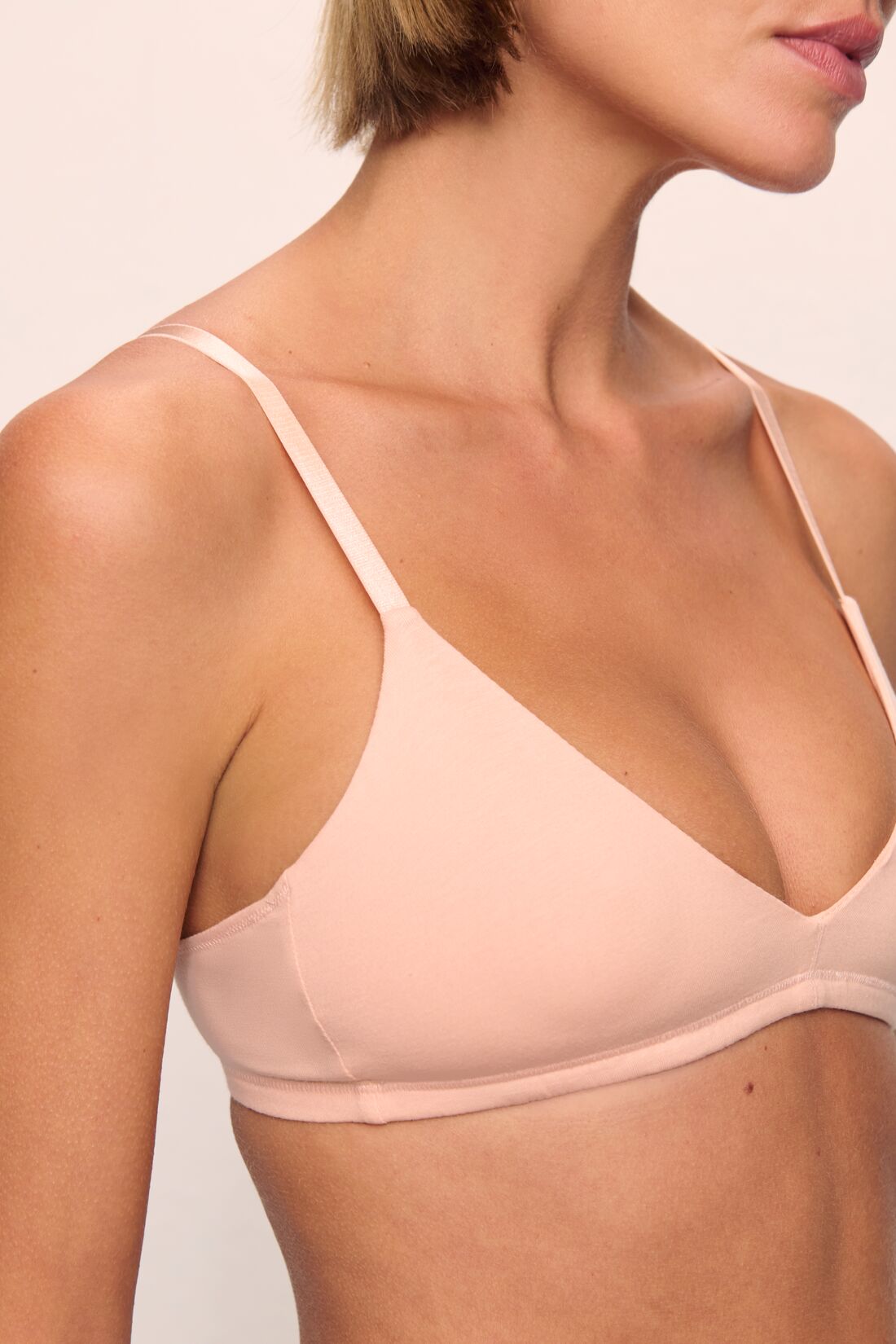 Model is wearing Pima Stretch Cotton Bralette in Buff