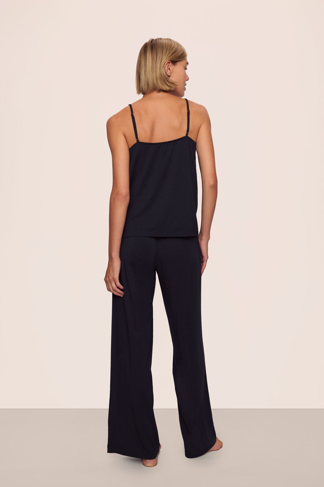 Model is wearing Gisele TENCEL™ Modal Cami & Pant PJ Set in Black