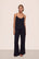 Model is wearing Gisele TENCEL™ Modal Cami & Pant PJ Set in Black
