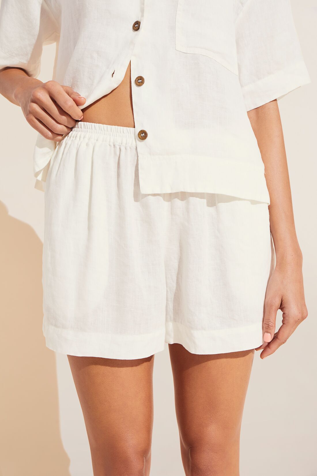 Model is wearing Garment Dyed Linen Short Set in Ivory.