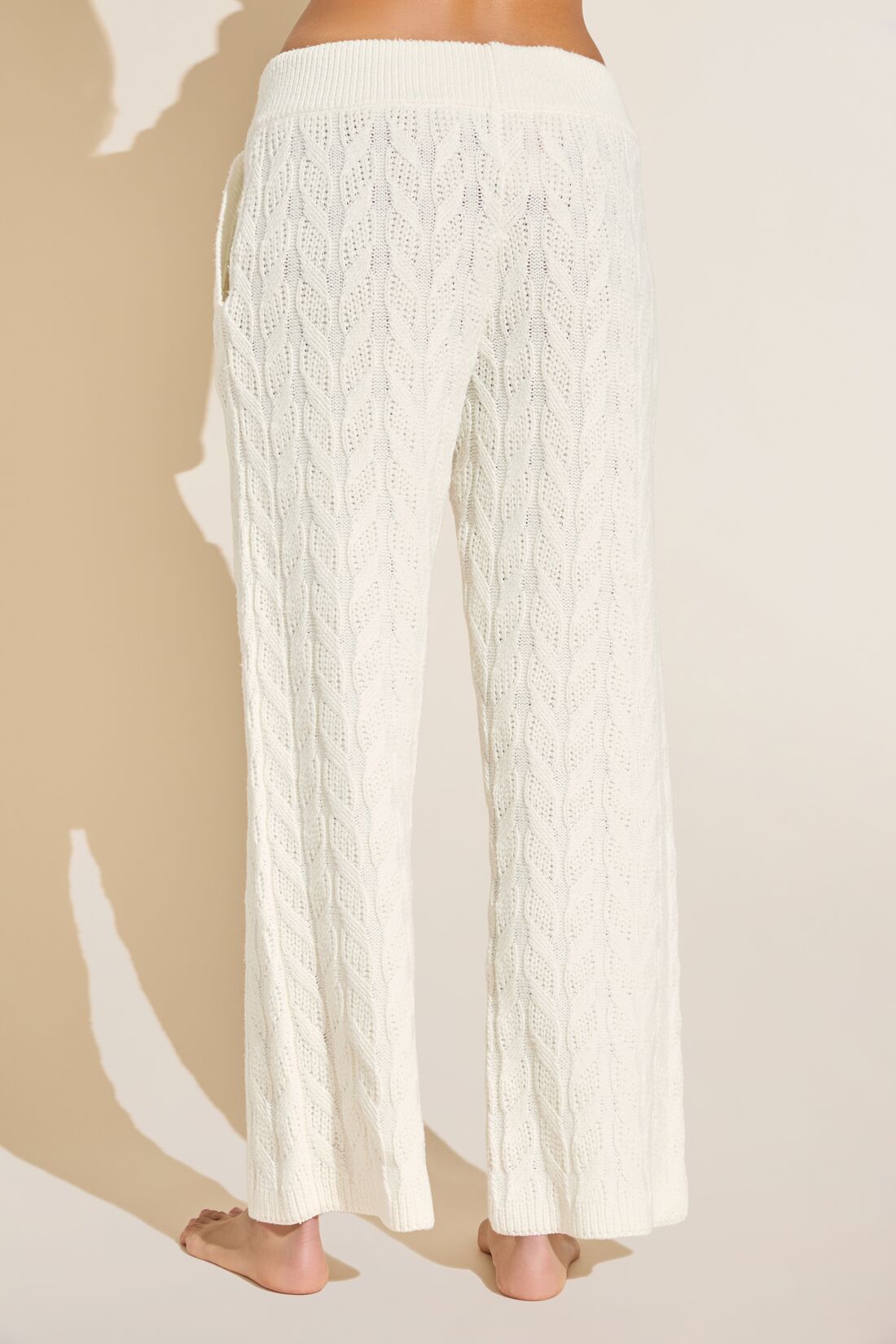Model wears Cable Knit Recycled Sweater Straight Leg Pant in Ivory.