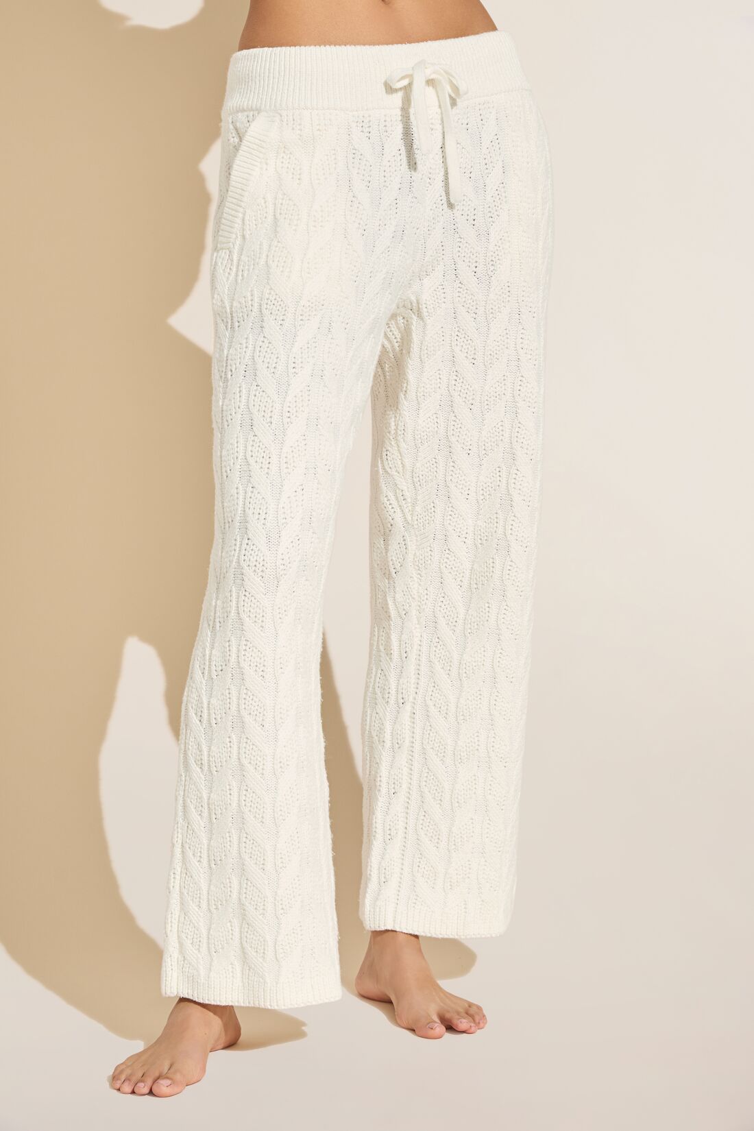 Model wears Cable Knit Recycled Sweater Straight Leg Pant in Ivory.