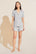 Model wears Gisele TENCEL™ Modal Rib Relaxed Short PJ Set in light heather grey.