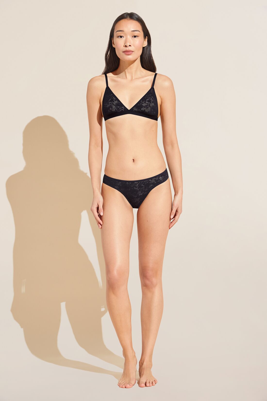 Model wears Soft Stretch Recycled Lace Triangle Bralette in Black.