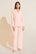 Model is Wearing the Gisele TENCEL™ Modal Long PJ Set in Petal Pink/Ivory.