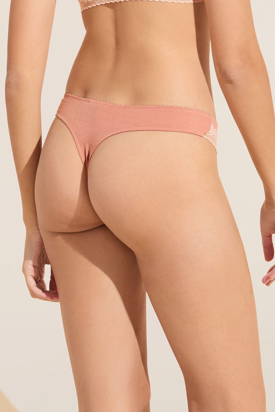 Model wears Flora TENCEL™ Modal Thong in Pink Rouge/Rose.