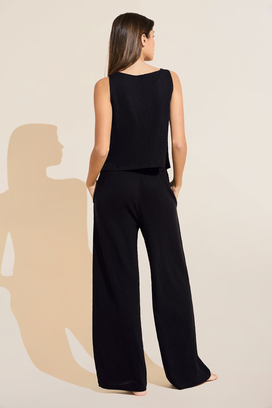 Model wears Organic Linen Knit High Waisted Pant in Black.