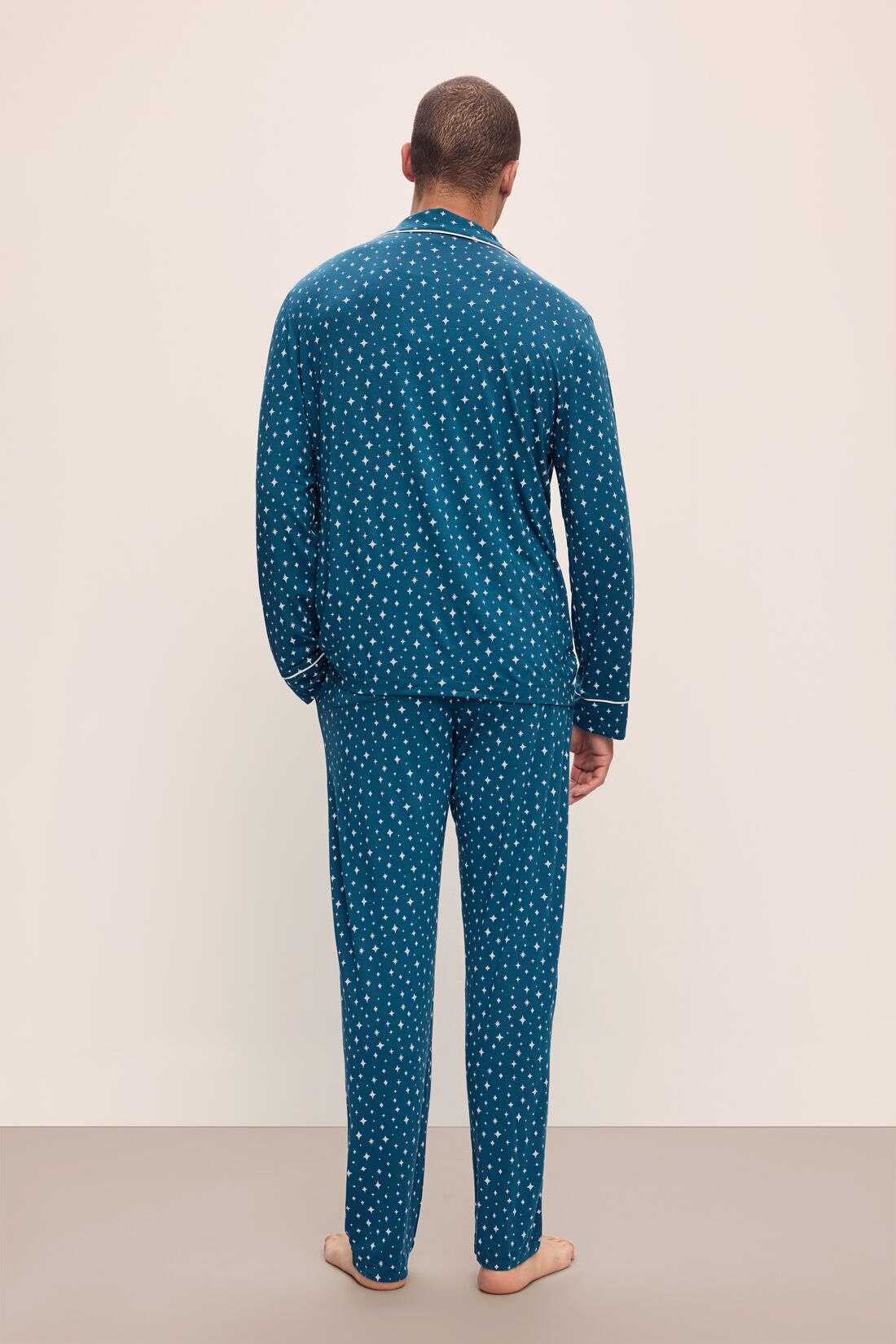 Model wears William Printed TENCEL™ Modal Long PJ Set in Festive Lights Sapphire/Ivory.