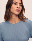 Model is wearing Pointelle Short Sleeve Tee in Faded Denim