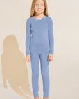 Model wears Kids TENCEL™ Modal Unisex Long PJ Set in Wedgewood Blue/Ivory.