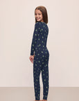 Model wears Kids Printed TENCEL™ Modal Unisex Long PJ Set in Woodland Pine Navy/Ivory.