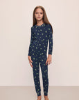 Model wears Kids Printed TENCEL™ Modal Unisex Long PJ Set in Woodland Pine Navy/Ivory.
