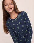 Model wears Kids Printed TENCEL™ Modal Unisex Long PJ Set in Woodland Pine Navy/Ivory.
