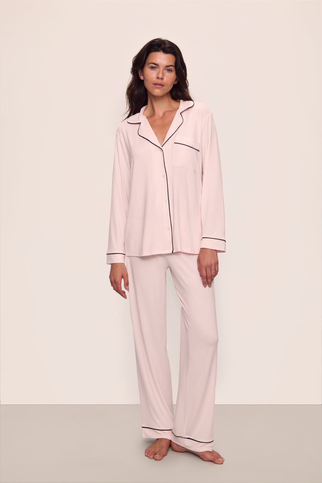Model is wearing Gisele TENCEL™ Modal Long PJ Set in Sorbet Pink/Black