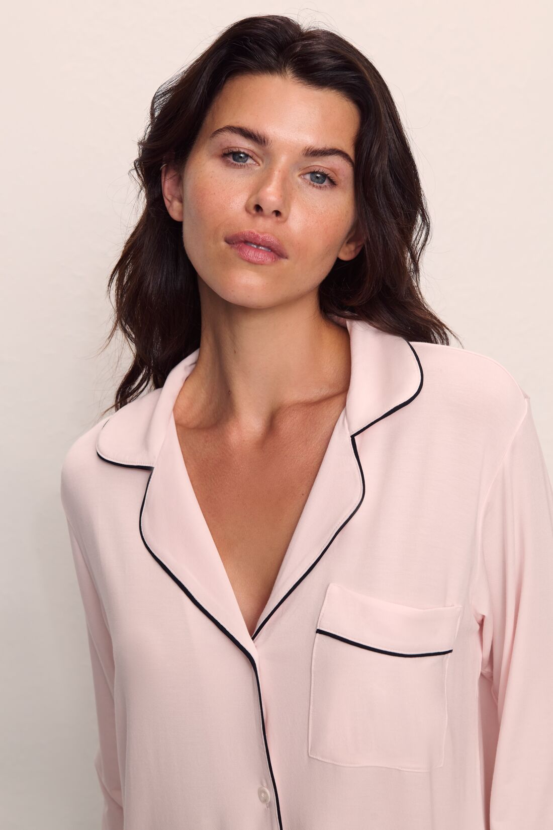 Model is wearing Gisele TENCEL™ Modal Long PJ Set in Sorbet Pink/Black