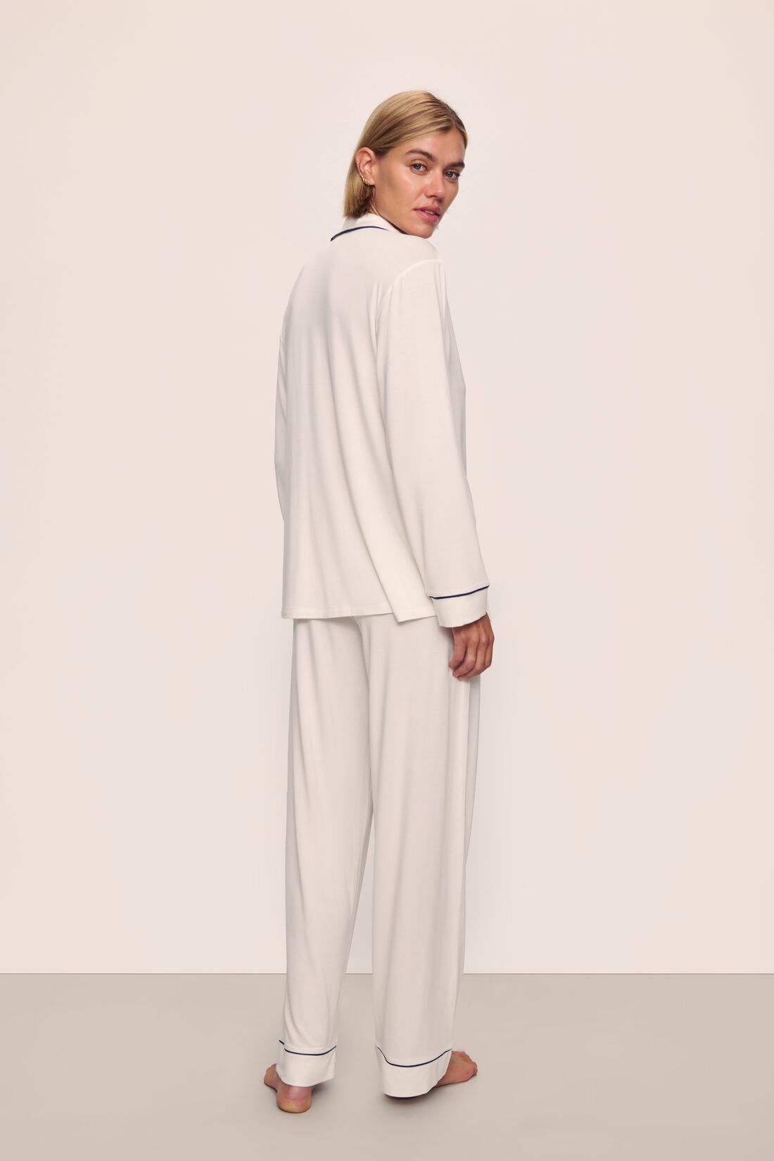 Model wears Gisele TENCEL™ Modal Long PJ Set in Pure Ivory/Navy