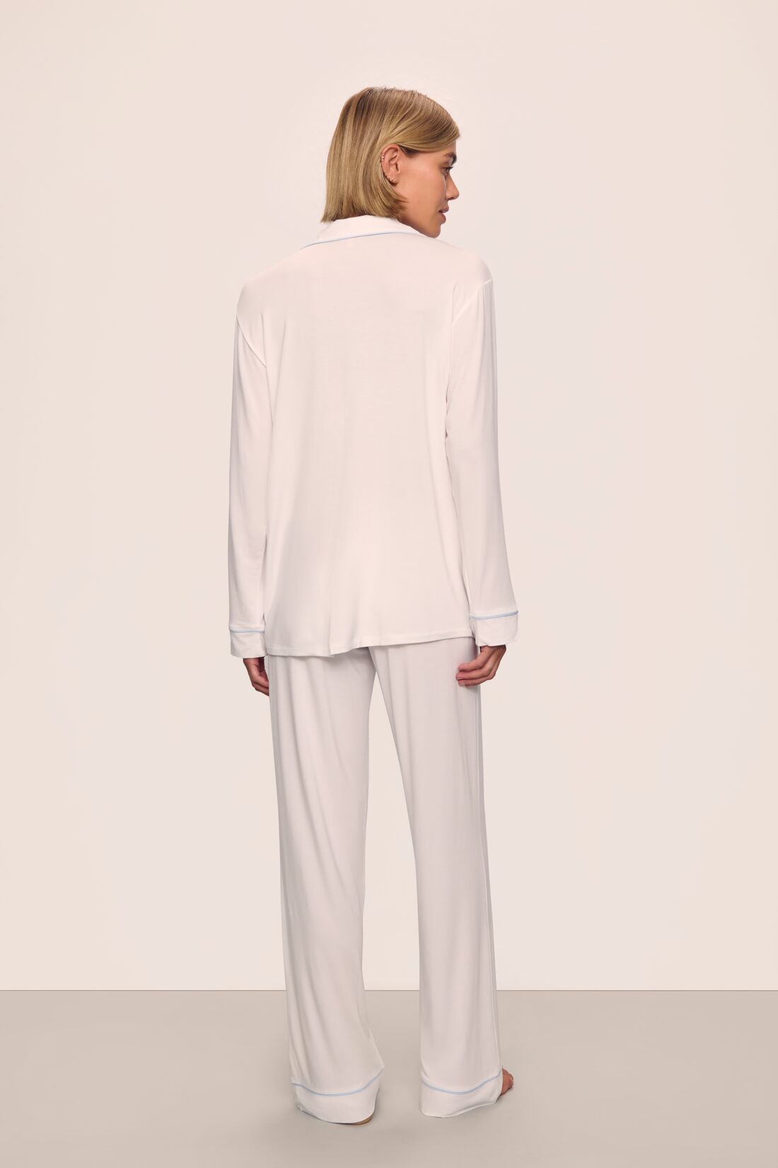 Model is wearing Gisele TENCEL™ Modal Long PJ Set in White/Ice Blue