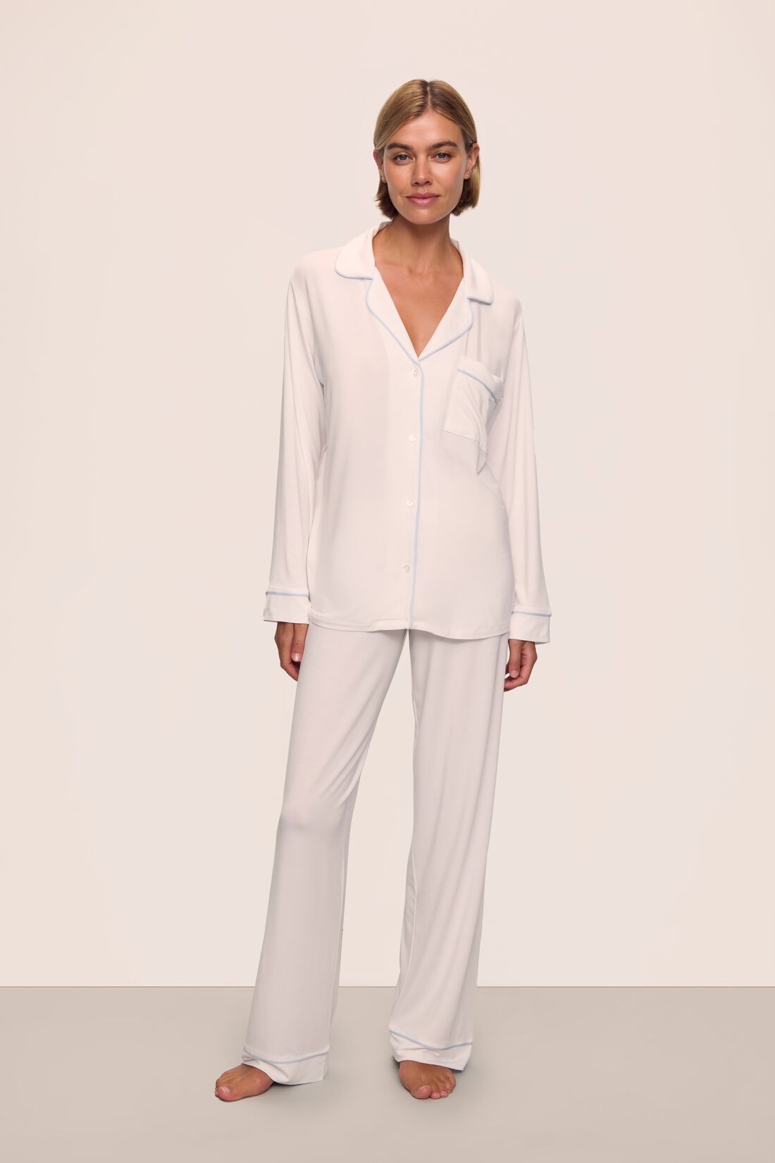Model is wearing Gisele TENCEL™ Modal Long PJ Set in White/Ice Blue