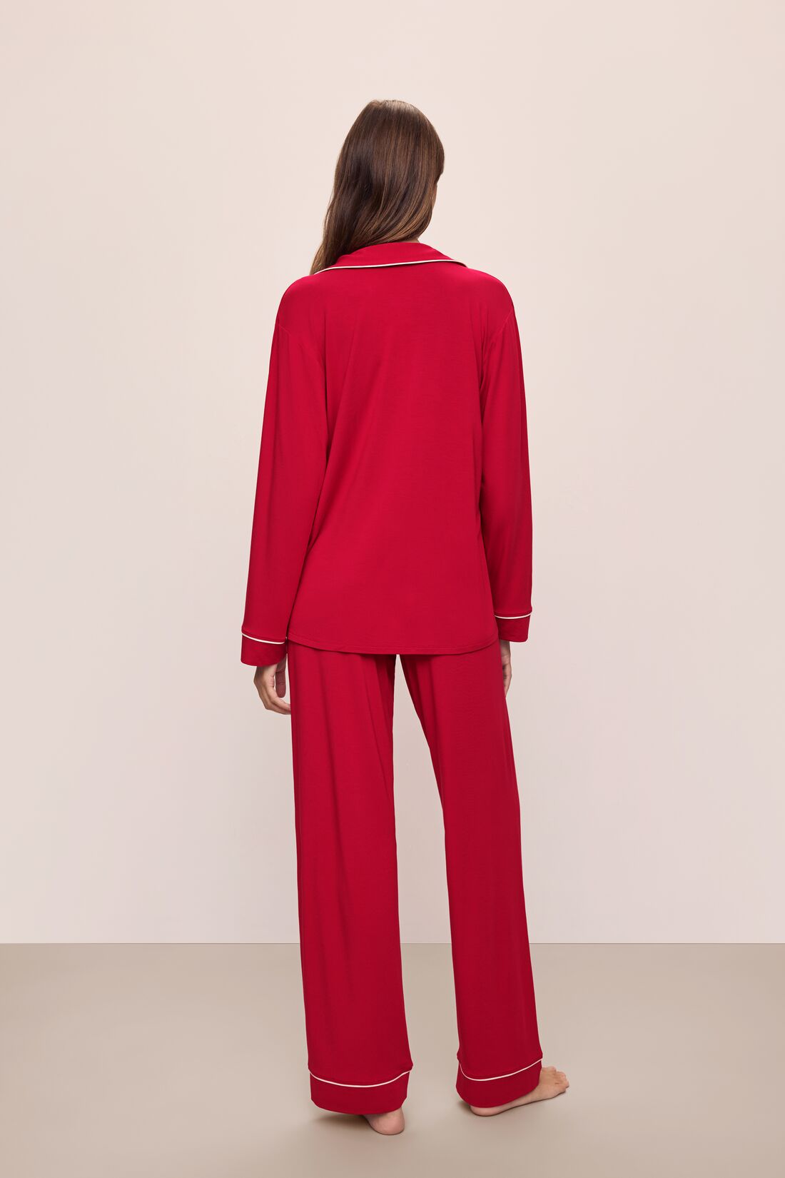 Model wears the Gisele TENCEL™ Modal Long PJ Set in Haute Red/Ivory.