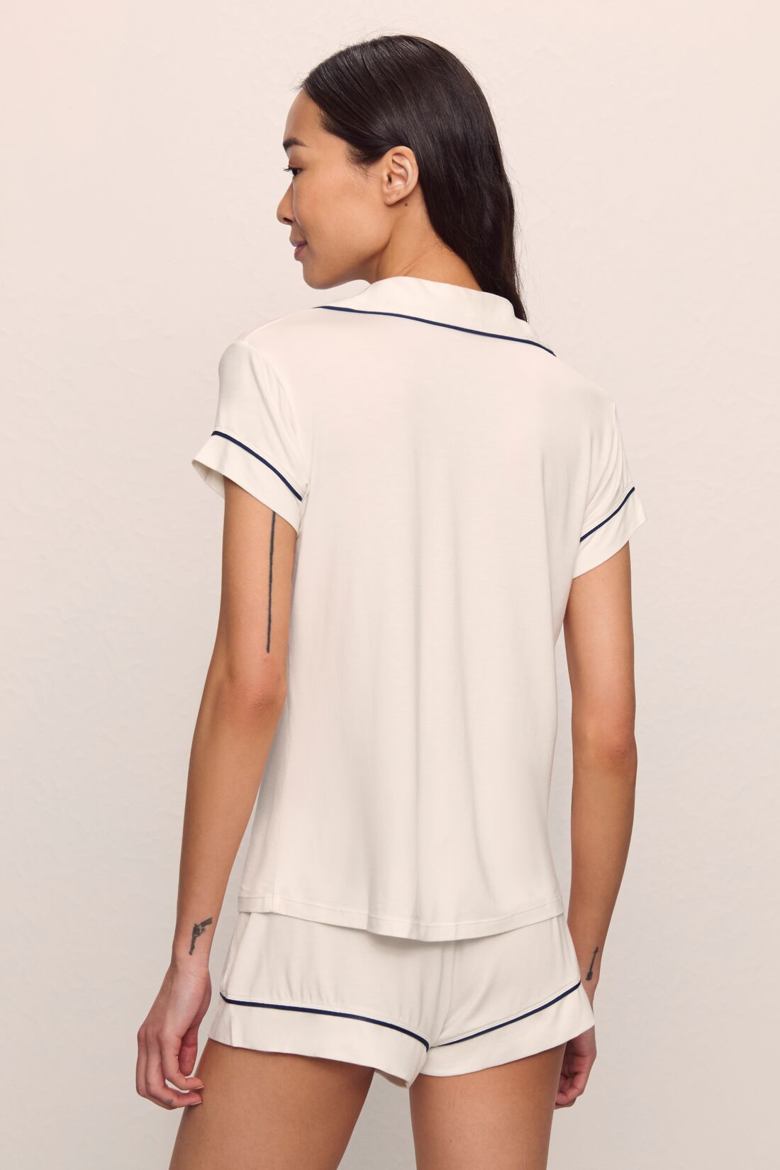 Model is wearing Gisele TENCEL™ Modal Shortie Short PJ Set in Pure Ivory/Navy