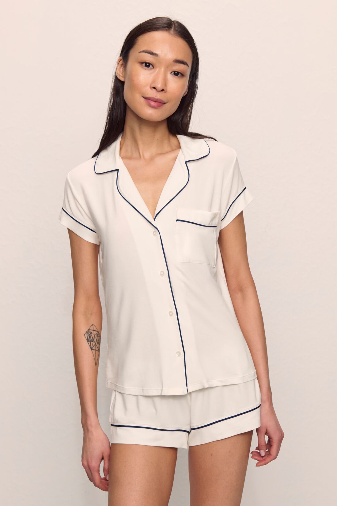 Model is wearing Gisele TENCEL™ Modal Shortie Short PJ Set in Pure Ivory/Navy