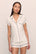 Model is wearing Gisele TENCEL™ Modal Shortie Short PJ Set in Pure Ivory/Navy