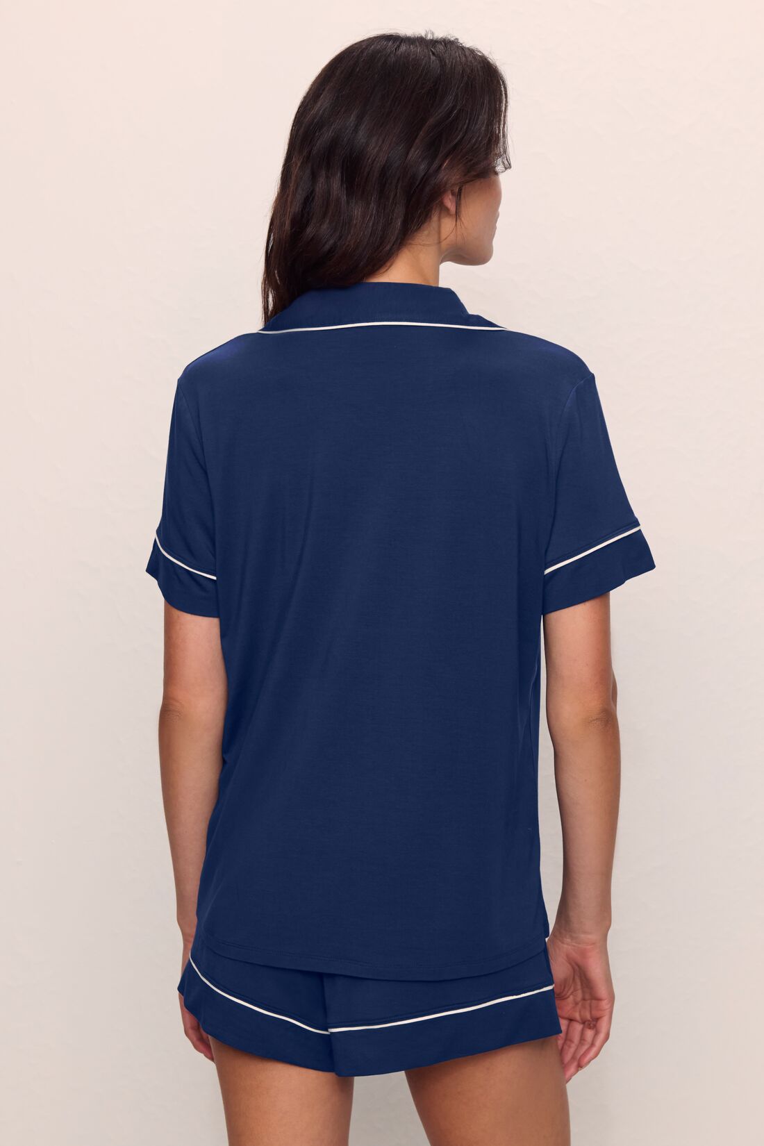 Model is wearing Gisele TENCEL™ Modal Relaxed Short PJ Set in Navy/Ivory