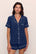 Model is wearing Gisele TENCEL™ Modal Relaxed Short PJ Set in Navy/Ivory
