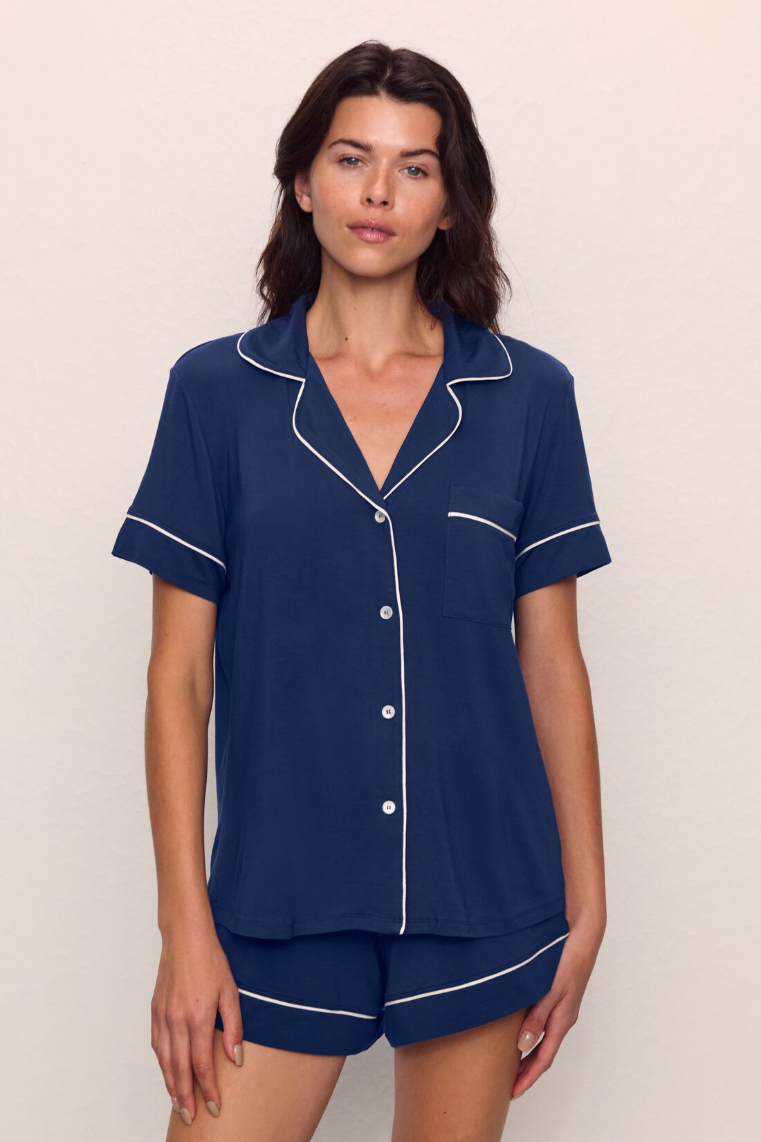 Model is wearing Gisele TENCEL™ Modal Relaxed Short PJ Set in Navy/Ivory