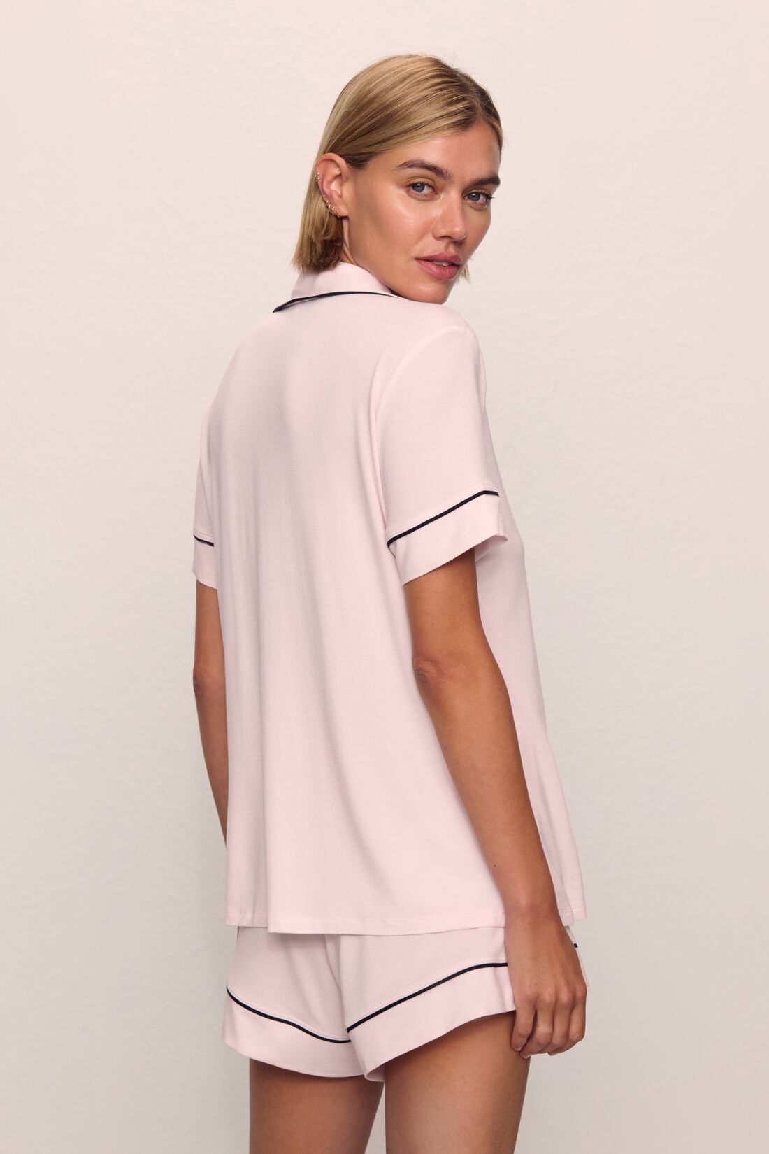Model is wearing Gisele TENCEL™ Modal Relaxed Short PJ Set in Sorbet Pink/Black