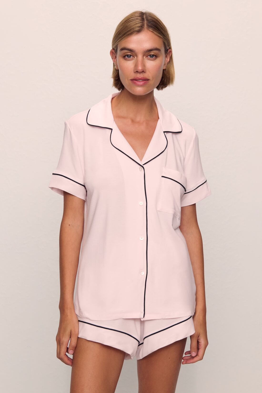Model is wearing Gisele TENCEL™ Modal Relaxed Short PJ Set in Sorbet Pink/Black