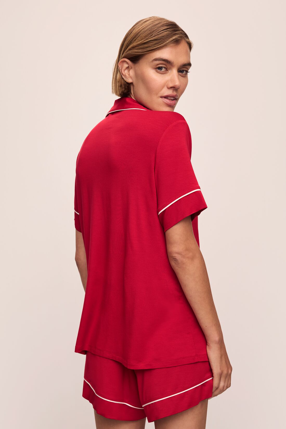Model wears the Gisele TENCEL™ Modal Relaxed Short PJ Set in Haute Red/Ivory.